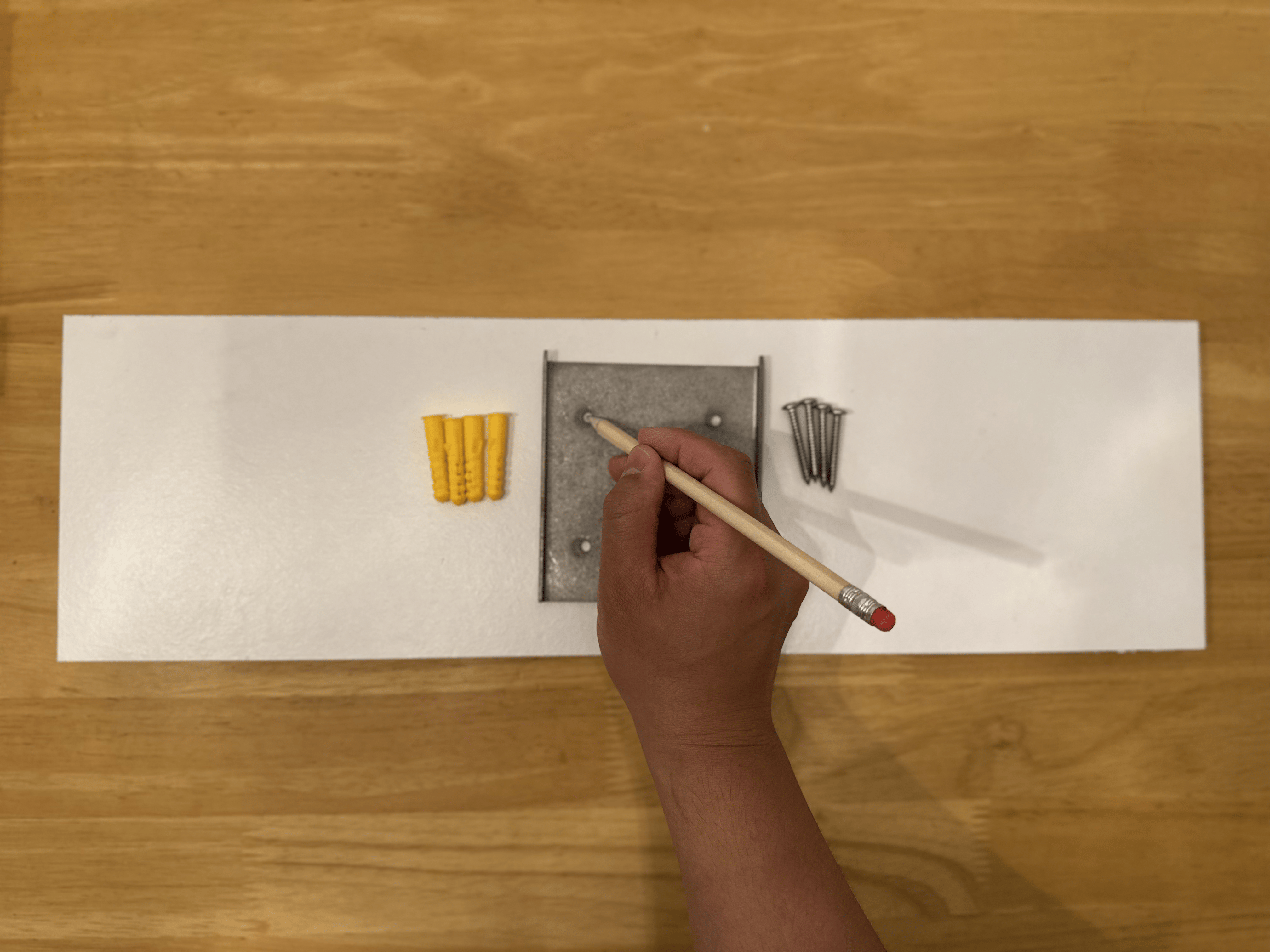 Marking the mounting holes through the metal plate